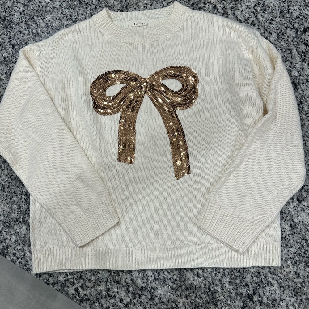 JODIFL Cream Crew Neck Sweater with Gold Sequin Bow